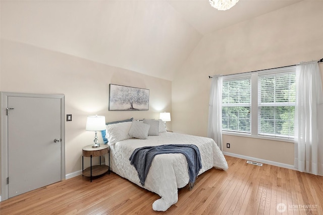 8495 Landing Ln SE, Port Orchard, WA 98367 - bedroom featuring light wood-type flooring and lofted ceiling