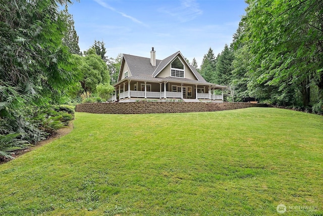 8495 Landing Ln SE, Port Orchard, WA 98367 - farmhouse-style home with covered porch, a chimney, and a front yard