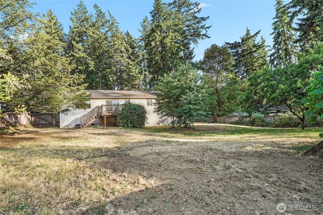 1910 192nd Avenue Ct SW, Lakebay, WA 98349 - view of yard featuring stairs and a wooden deck