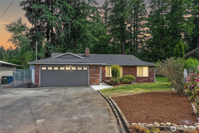 15518SE 304th Pl, Kent, WA 98042 - ranch-style house with asphalt driveway, brick siding, a garage, and a chimney