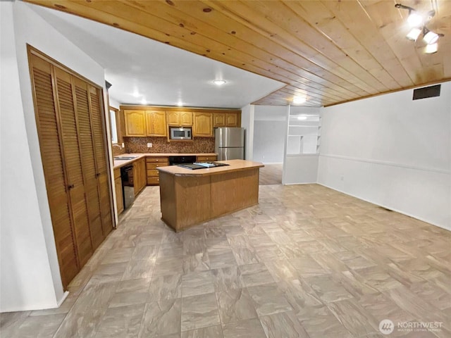 15518SE 304th Pl, Kent, WA 98042 - kitchen featuring stainless steel appliances, a kitchen island, decorative backsplash, open floor plan, and light countertops