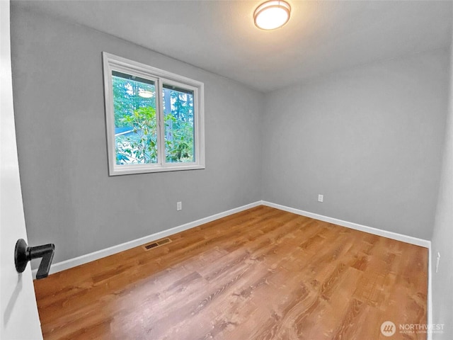 15518SE 304th Pl, Kent, WA 98042 - unfurnished room featuring baseboards and wood finished floors