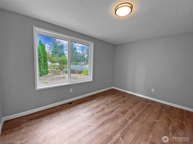 15518SE 304th Pl, Kent, WA 98042 - empty room with wood finished floors and baseboards