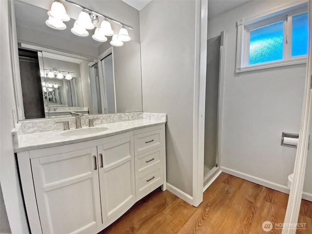 15518SE 304th Pl, Kent, WA 98042 - full bath featuring wood finished floors, vanity, a chandelier, and a stall shower