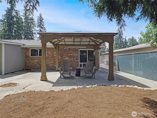 15518SE 304th Pl, Kent, WA 98042 - rear view of house featuring a gazebo, a patio area, and brick siding