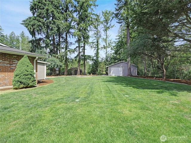 15518SE 304th Pl, Kent, WA 98042 - view of grassy yard with a detached garage and an outdoor structure