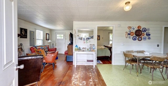 1215 199th Pl, Long Beach, WA 98631 - dining area featuring electric panel, wood finished floors, and wood walls