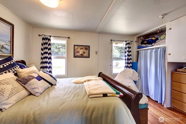 1215 199th Pl, Long Beach, WA 98631 - bedroom with multiple windows and wood finished floors