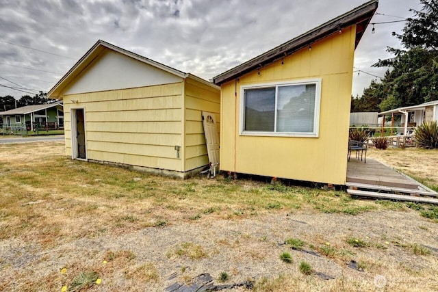 1215 199th Pl, Long Beach, WA 98631 - view of property exterior featuring a wooden deck and a yard