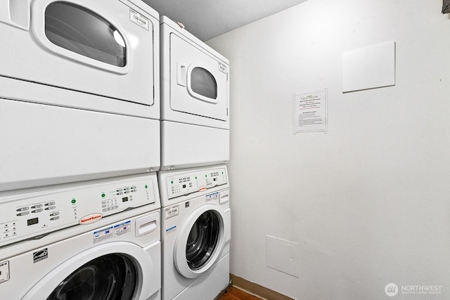 1105 Spring St Unit 407, Seattle, WA 98104 - washroom featuring washing machine and dryer and stacked washer and clothes dryer