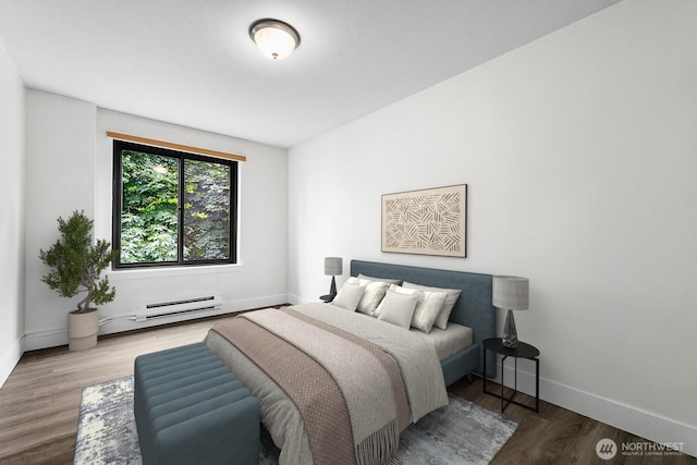 1105 Spring St Unit 407, Seattle, WA 98104 - bedroom with baseboard heating and wood finished floors