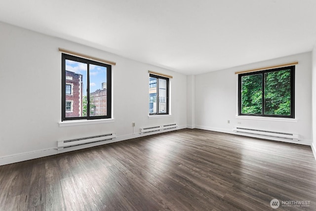 1105 Spring St Unit 407, Seattle, WA 98104 - unfurnished room featuring baseboard heating and healthy amount of natural light