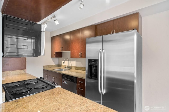 1105 Spring St Unit 407, Seattle, WA 98104 - kitchen with stainless steel appliances, light countertops, and rail lighting