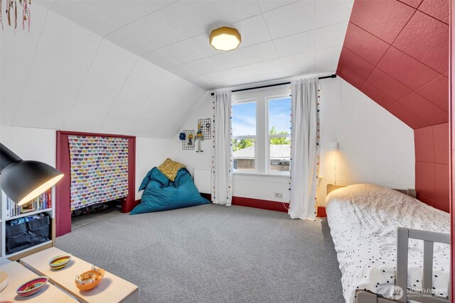 8554 16th Ave NW, Seattle, WA 98117 - carpeted bedroom with vaulted ceiling and baseboards