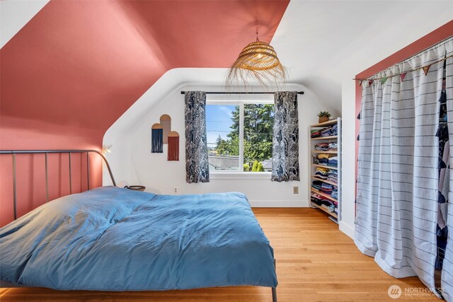8554 16th Ave NW, Seattle, WA 98117 - bedroom with wood finished floors and vaulted ceiling