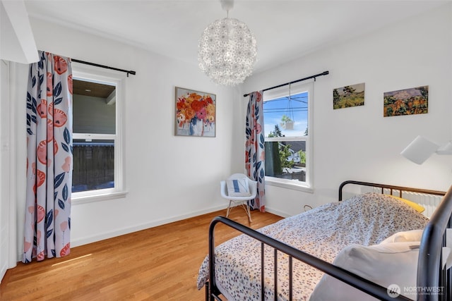 8554 16th Ave NW, Seattle, WA 98117 - bedroom with a chandelier and wood finished floors