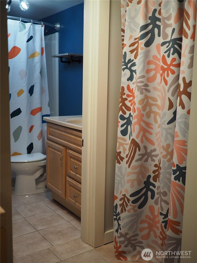 8554 16th Ave NW, Seattle, WA 98117 - full bathroom with tile patterned flooring, vanity, and a shower with curtain