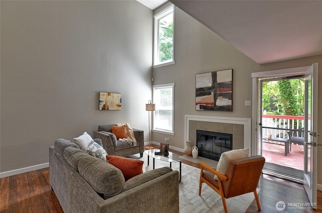 3030 128th Ave SE Unit 6, Bellevue, WA 98005 - living room with plenty of natural light, wood finished floors, a tile fireplace, and high vaulted ceiling