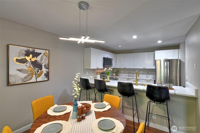 3030 128th Ave SE Unit 6, Bellevue, WA 98005 - dining room with dark wood-style floors and recessed lighting