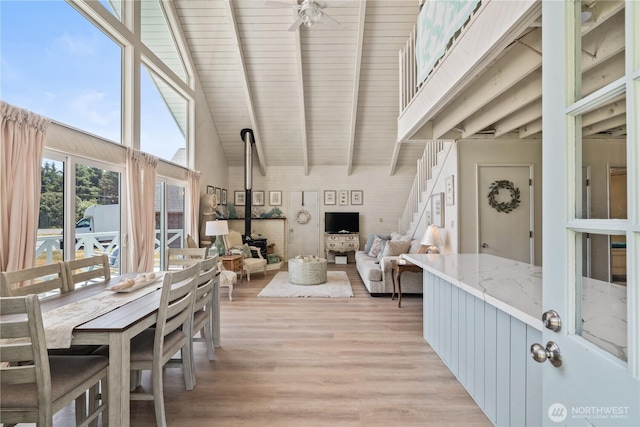 195 Ocean Shores Blvd SW, Ocean Shores, WA 98569 - living area with light wood finished floors, ceiling fan, high vaulted ceiling, and a wood ceiling with exposed beams