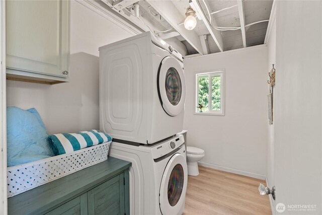 195 Ocean Shores Blvd SW, Ocean Shores, WA 98569 - laundry area featuring estacked washer and dryer and light wood finished floors
