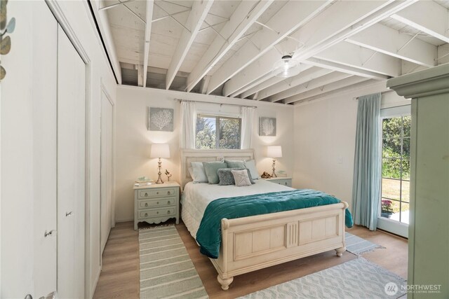 195 Ocean Shores Blvd SW, Ocean Shores, WA 98569 - bedroom with wood finished floors and access to outside