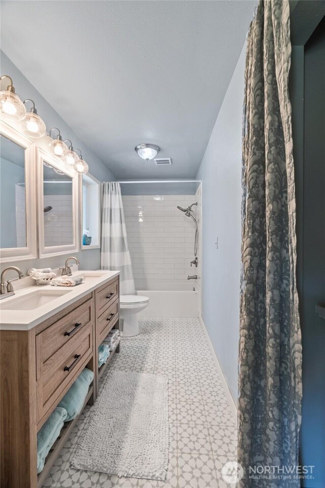 195 Ocean Shores Blvd SW, Ocean Shores, WA 98569 - full bathroom featuring double vanity, shower / bath combo, and tile patterned floors