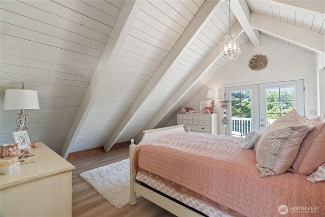 195 Ocean Shores Blvd SW, Ocean Shores, WA 98569 - bedroom featuring access to outside, french doors, wood finished floors, and a chandelier