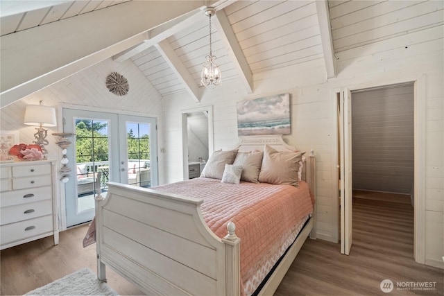 195 Ocean Shores Blvd SW, Ocean Shores, WA 98569 - bedroom featuring access to outside, wood finished floors, wood walls, french doors, and a chandelier