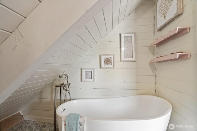 195 Ocean Shores Blvd SW, Ocean Shores, WA 98569 - full bathroom featuring a soaking tub, vaulted ceiling, and wood walls