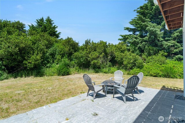 195 Ocean Shores Blvd SW, Ocean Shores, WA 98569 - view of patio / terrace with a fire pit