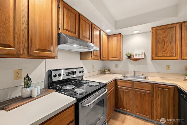 140 Summit Ave N Unit A6, Kent, WA 98030 - kitchen with stainless steel range with electric stovetop, under cabinet range hood, brown cabinetry, and recessed lighting