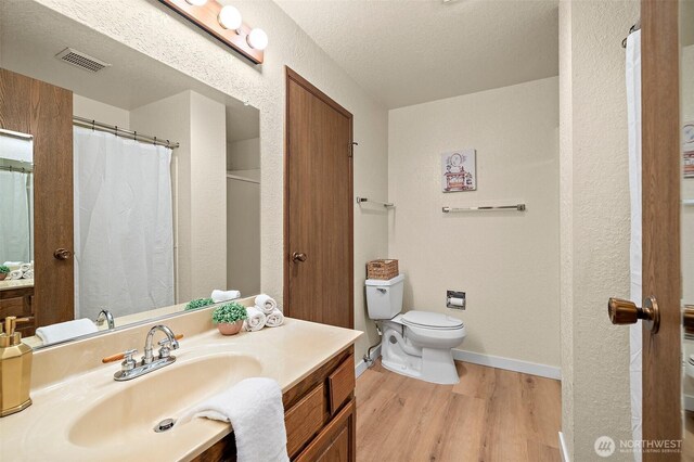 140 Summit Ave N Unit A6, Kent, WA 98030 - full bathroom with vanity, wood finished floors, and a textured ceiling