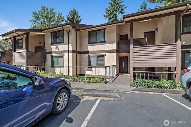 140 Summit Ave N Unit A6, Kent, WA 98030 - view of property featuring uncovered parking