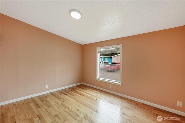 3001 S 288th Unit 89, Federal Way, WA 98003 - unfurnished room with light wood-style flooring and baseboards