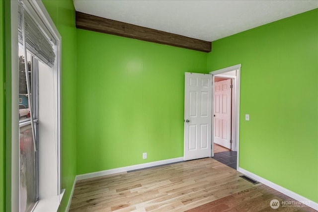 3001 S 288th Unit 89, Federal Way, WA 98003 - spare room featuring wood finished floors, beamed ceiling, and baseboards