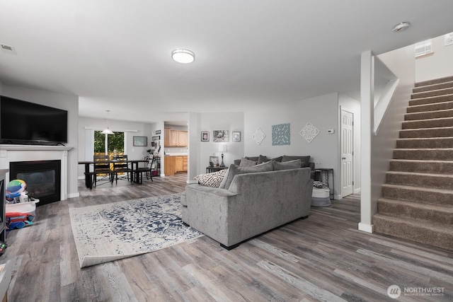 17814 97th Ln E, Puyallup, WA 98375 - living area with stairway, wood finished floors, and a glass covered fireplace