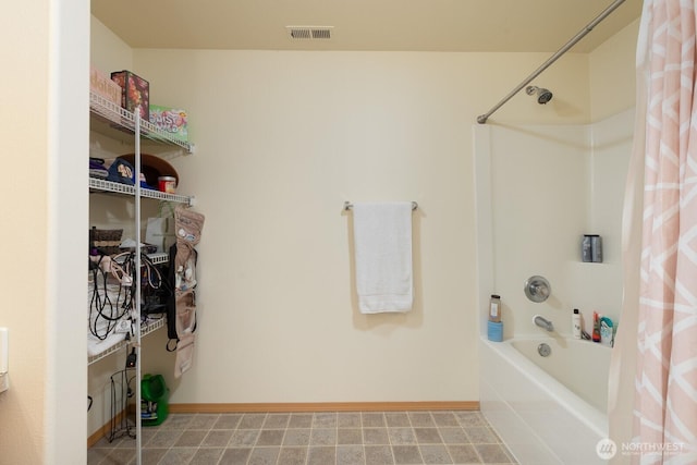 17814 97th Ln E, Puyallup, WA 98375 - bathroom featuring shower / bath combo with shower curtain and baseboards