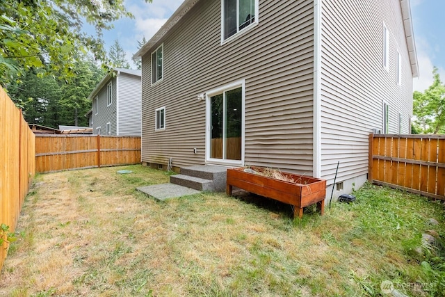 17814 97th Ln E, Puyallup, WA 98375 - rear view of house featuring a fenced backyard, crawl space, and entry steps