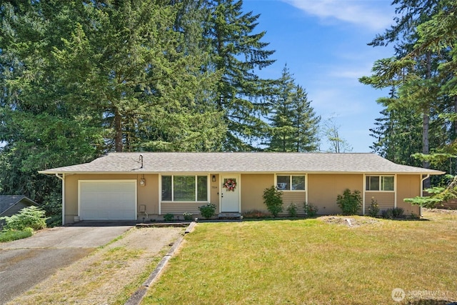 7514 Greenridge St SW, Olympia, WA 98512 - single story home with asphalt driveway, an attached garage, a front yard, and stucco siding