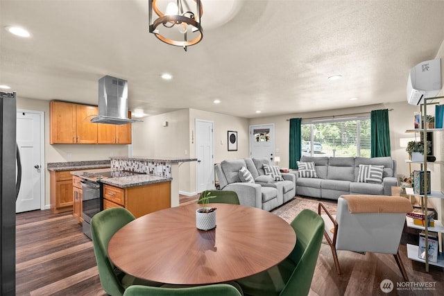 7514 Greenridge St SW, Olympia, WA 98512 - dining room with dark wood-style floors, recessed lighting, an AC wall unit, a chandelier, and baseboards