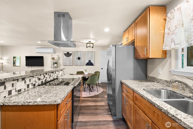 7514 Greenridge St SW, Olympia, WA 98512 - kitchen with island range hood, black / electric stove, a sink, dark wood-style floors, and brown cabinets