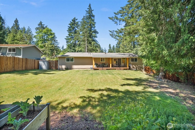 7514 Greenridge St SW, Olympia, WA 98512 - rear view of house featuring a garden