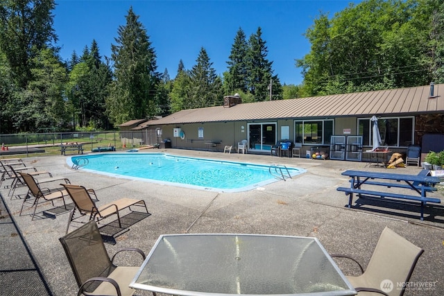7514 Greenridge St SW, Olympia, WA 98512 - community pool with a patio and view of wooded area