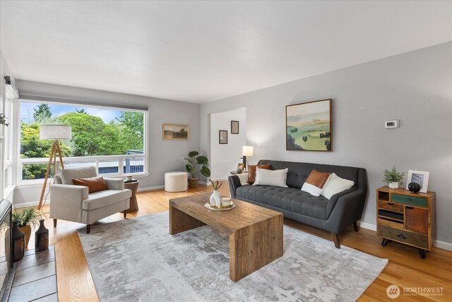 3604 SW Graham St, Seattle, WA 98126 - living area with light wood-style flooring and baseboards