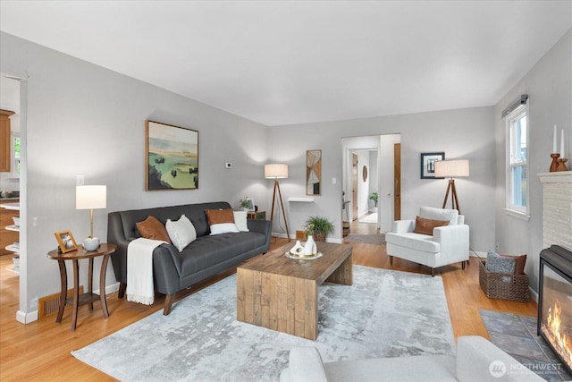 3604 SW Graham St, Seattle, WA 98126 - living area featuring a fireplace and wood finished floors