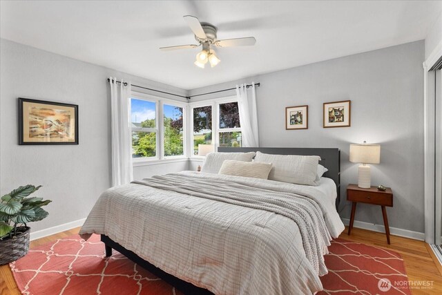 3604 SW Graham St, Seattle, WA 98126 - bedroom with wood finished floors and a ceiling fan