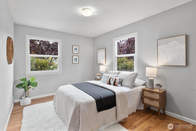 3604 SW Graham St, Seattle, WA 98126 - bedroom with multiple windows and light wood-style floors