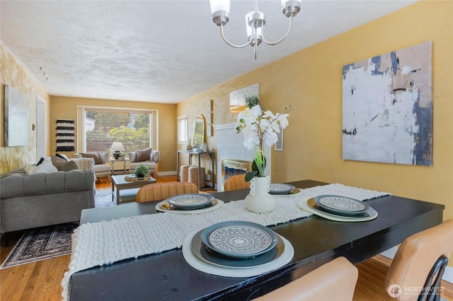 13743 36th Ave NE, Seattle, WA 98125 - dining space featuring a chandelier and wood finished floors