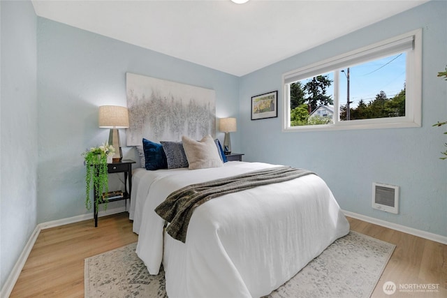 13743 36th Ave NE, Seattle, WA 98125 - bedroom with wood finished floors and heating unit